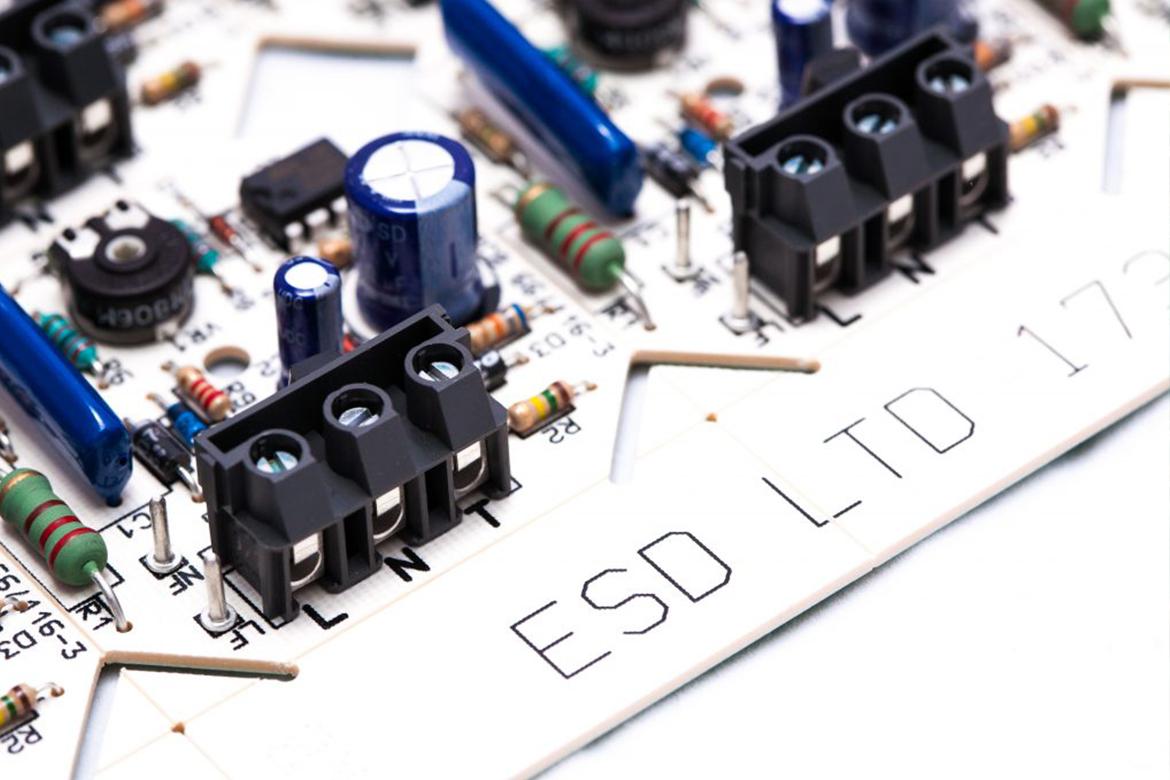 White PCB with ESD name and through hole components