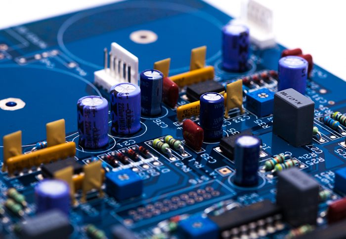 Blue PCB with various through hole components fitted
